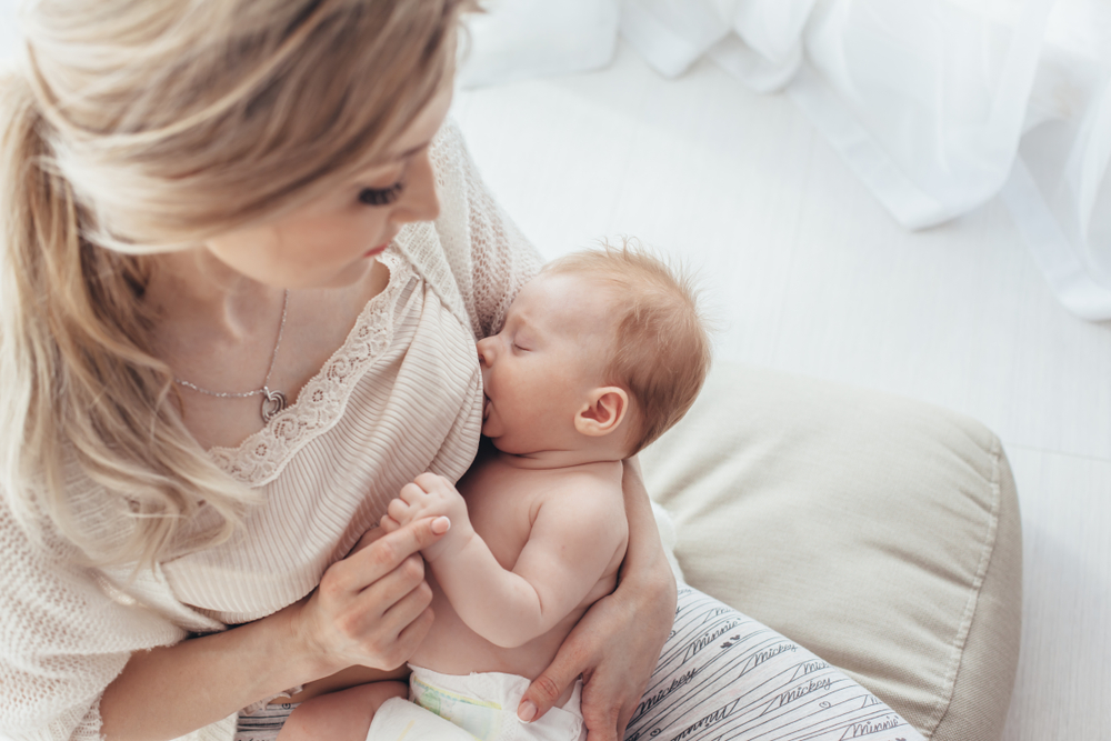 woman breastfeeding her child