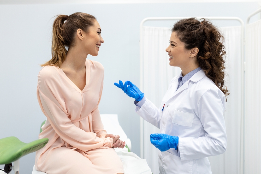 woman talking to female doctor in the office.